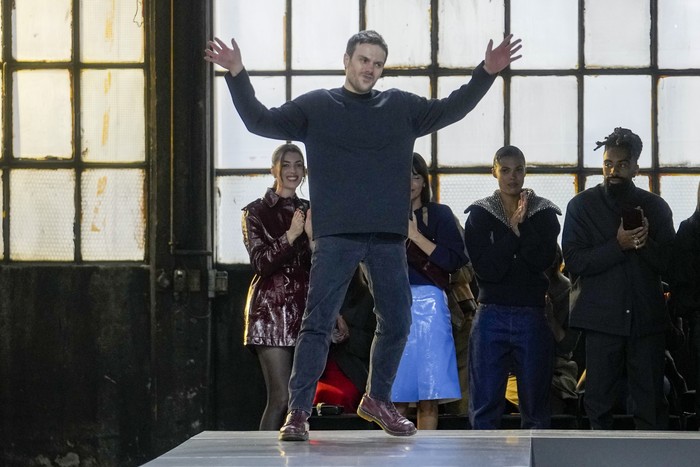 Stylist Sabato De Sarno acknowledges the audience at the end of the unveiling of the Gucci womens Fall-Winter 2024-25 collection presented in Milan, Italy, Friday, Feb. 23, 2024. (AP Photo/Luca Bruno)