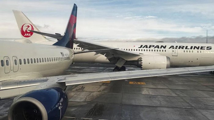 The right wing of a Japan Airlines jet strikes the tail of a Delta Air Lines plane while the aircraft were taxiing at Seattle-Tacoma International Airport in SeaTac, King County, Washington, U.S.,February 5, 2025, in this picture obtained from social media. 