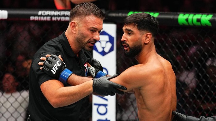 SYDNEY, AUSTRALIA - FEBRUARY 09: Anshul Jubli of India reacts after a TKO loss against Quillan Salkilld of Australia in a lightweight fight during the UFC 312 event at Qudos Bank Arena on February 09, 2025 in Sydney, Australia.  (Photo by Jeff Bottari/Zuffa LLC)