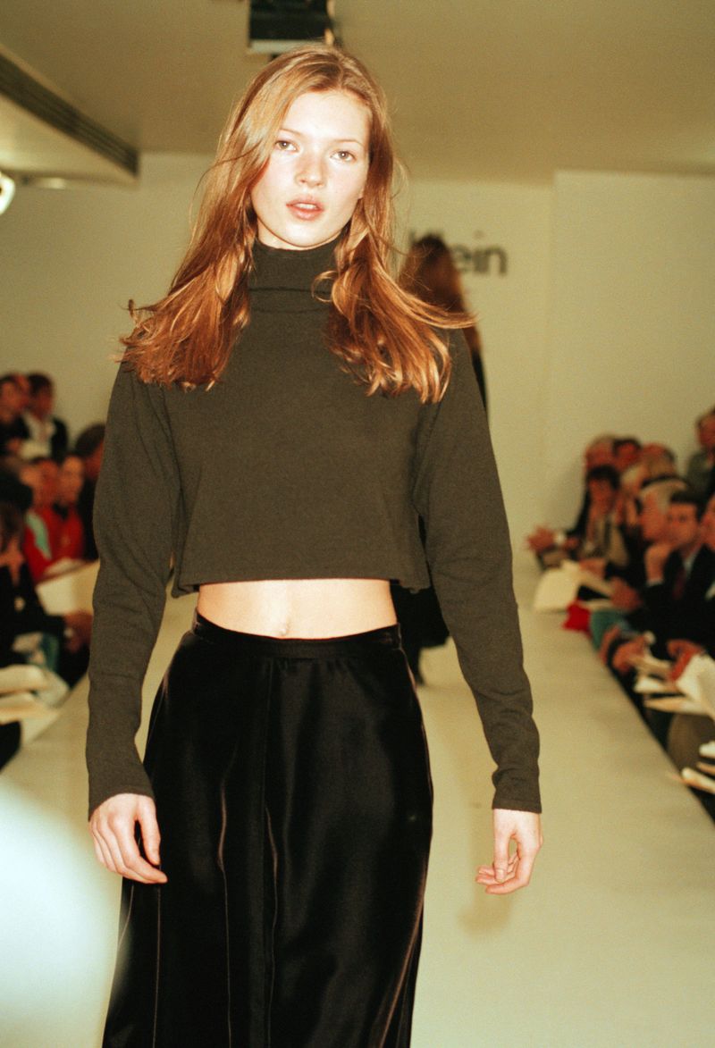 Model Kate Moss wears a bare midriff outfit from Calvin Klein's Fall 1993 collection on the designer's runway in New York on June 1, 1993. (AP Photo/Chrystyna Czajkowsky)