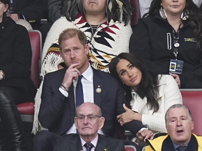 Britains Prince Harry and Meghan Markle, the Duke and Duchess of Sussex, attend the opening ceremony of the 2025 Invictus Games in Vancouver, Canada, Saturday, Feb. 8, 2025. (Aaron Chown/PA via AP)