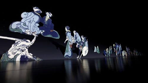 A visitor attends an exhibition that uses cutting-edge technology to bring to life the work of iconic samurai-era ukiyo-e artist Katsushika Hokusai at 'HOKUSAI: ANOTHER STORY in TOKYO', technical wizardry from Sony PCL Inc. and Ars Techne Corp, and the woodblock prints provided by the Yamanashi Prefectural Museum that owns the original work, during a preview event in Tokyo, Japan January 30, 2025.  REUTERS/Issei Kato