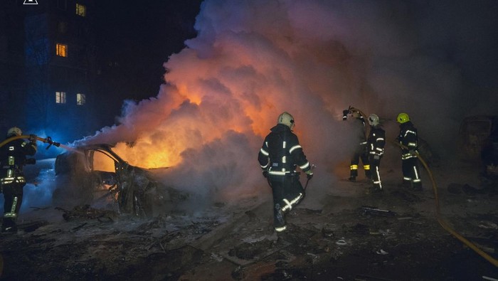 Firefighters work at a site of a residential area hit by a Russian drone strike, amid Russia's attack on Ukraine, in Sumy, Ukraine, in this handout picture released on February 10, 2025. Press service of the State Emergency Service of Ukraine in Sumy region/Handout via REUTERS ATTENTION EDITORS - THIS IMAGE HAS BEEN SUPPLIED BY A THIRD PARTY. DO NOT OBSCURE LOGO.