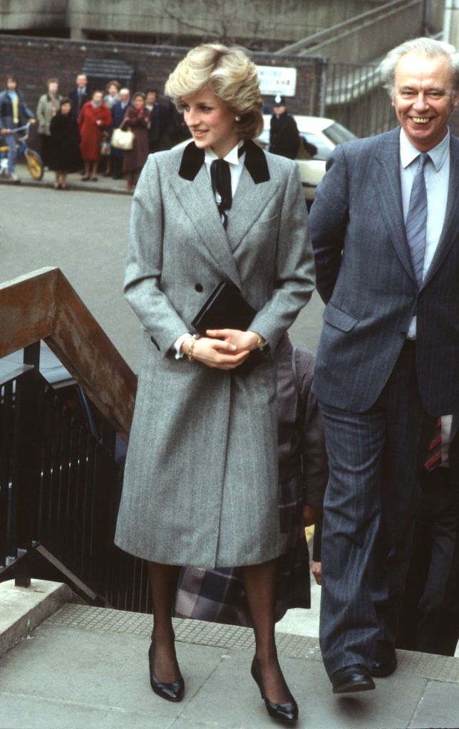 LONDON, ENGLAND - MARCH 07: Diana, Princess of Wales, wearing a grey Herringbone coat with a velvet collar designed by Jan Van Velden and a 'Teddy Bow' style bow tied round her neck, visits a health centre in Lisson Grove on March 7, 1984 in London, United Kingdom. (Photo by Anwar Hussein/Getty Images)