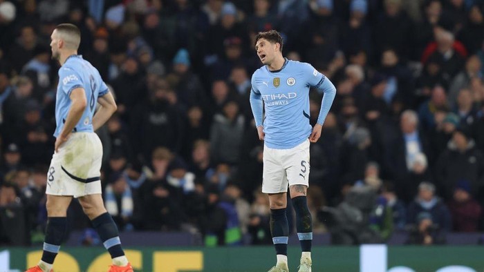 MANCHESTER, ENGLAND - FEBRUARY 11: John Stones of Manchester City reacts during the UEFA Champions League 2024/25 League Knockout Play-off first leg match between Manchester City and Real Madrid C.F. at Manchester City Stadium on February 11, 2025 in Manchester, England. (Photo by Crystal Pix/MB Media/Getty Images)