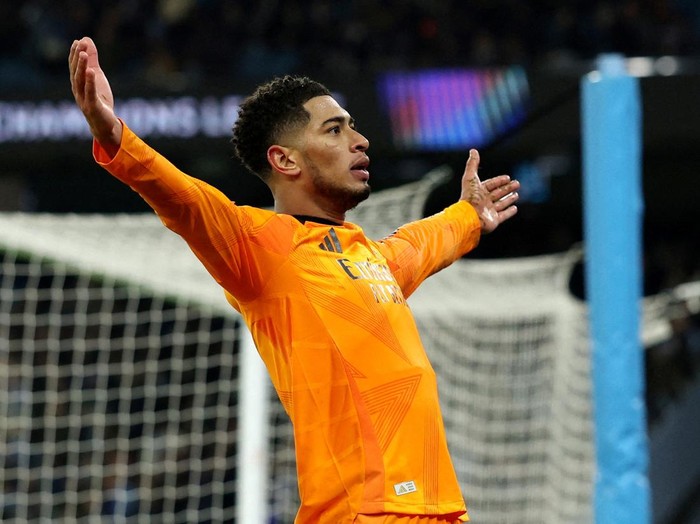 Soccer Football - Champions League - Knockout Phase Playoff - First Leg - Manchester City v Real Madrid - Etihad Stadium, Manchester, Britain - February 11, 2025  Real Madrid's Jude Bellingham celebrates scoring their third goal REUTERS/Phil Noble     TPX IMAGES OF THE DAY