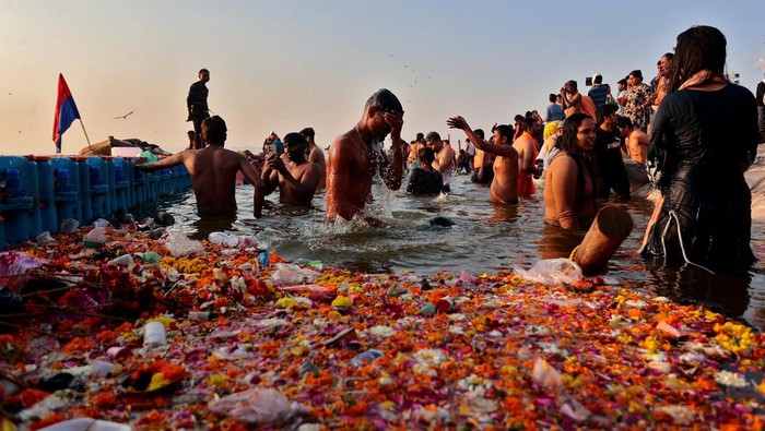 Devotees take a dip at Sangam, the confluence of the Ganges and Yamuna rivers with the mythical invisible Saraswati river, to mark Maghi Purnima, one of the auspicious days during the 