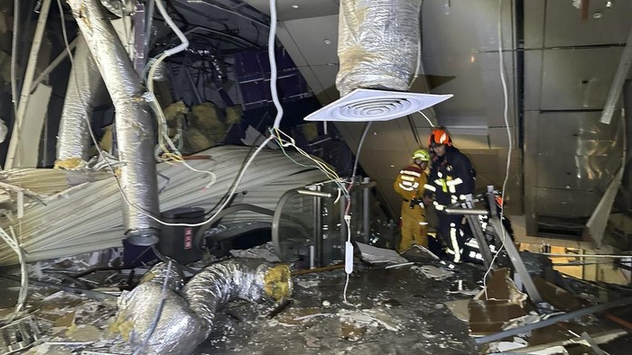 In this drone photo taken and released by National Fire Agency, the damaged facade is seen in the aftermath of an explosion at the Shin Kong Mitsukoshi department store in Taichung city in Taiwan on Thursday, Feb. 13, 2025. (National Fire Agency via AP)