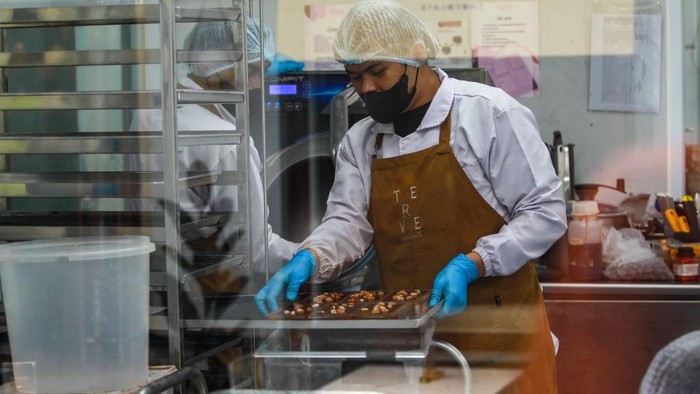 Workers finish making chocolate at Terve Artisan Chocolate Factory in Bandung, West Java, Indonesia, on February 13, 2025. Ahead of Valentine's Day 2025, Terve Chocolate Factory makes Valentine-themed chocolates. (Photo by Khairizal Maris/NurPhoto via Getty Images)