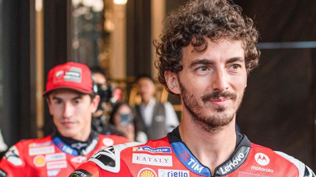 BANGKOK, THAILAND - 2025/02/09: Italian rider Francesco Bagnaia (R) of Ducati Lenovo Team seen during the MotoGP Season Premiere 2025 launch event at One Bangkok mall. (Photo by Peerapon Boonyakiat/SOPA Images/LightRocket via Getty Images)