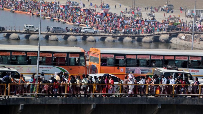 Devotees gather to take a dip at Sangam, the confluence of the Ganges and Yamuna rivers with the mythical invisible Saraswati river, to mark Maghi Purnima, one of the auspicious days during the 