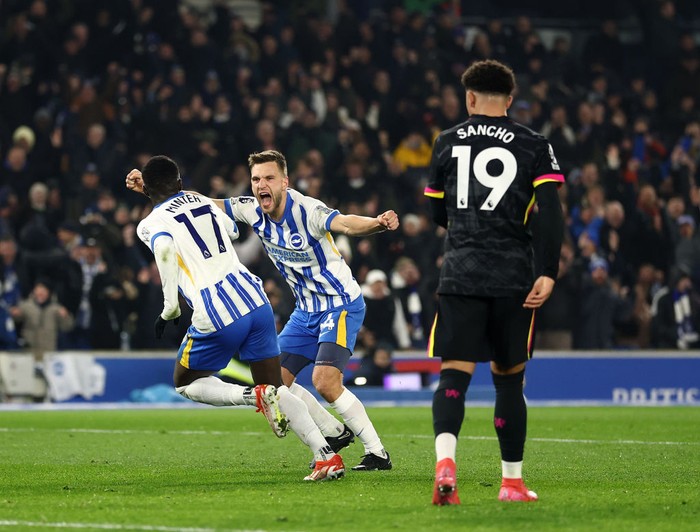 BRIGHTON, ENGLAND - FEBRUARY 14: Yankuba Minteh of Brighton & Hove Albion (L) celebrates scoring his teams second goal with teammate Joel Veltman during the Premier League match between Brighton & Hove Albion FC and Chelsea FC at Amex Stadium on February 14, 2025 in Brighton, England. (Photo by Bryn Lennon/Getty Images)