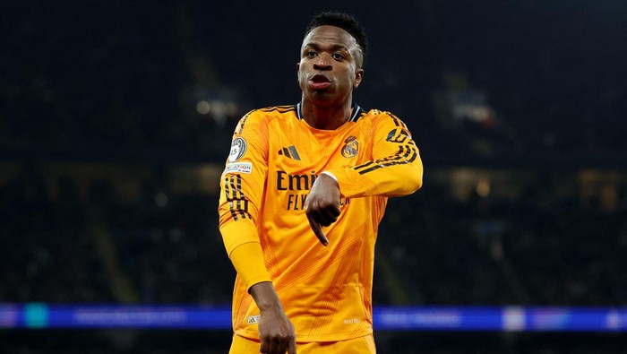Soccer Football - Champions League - Knockout Phase Playoff - First Leg - Manchester City v Real Madrid - Etihad Stadium, Manchester, Britain - February 11, 2025  Real Madrids Vinicius Junior celebrates their second goal scored by Real Madrids Brahim Diaz REUTERS/Phil Noble