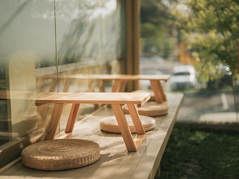 Beautiful terrace in Japanese style exterior design restaurant with Japaneses coffee table set on tatami cushion
