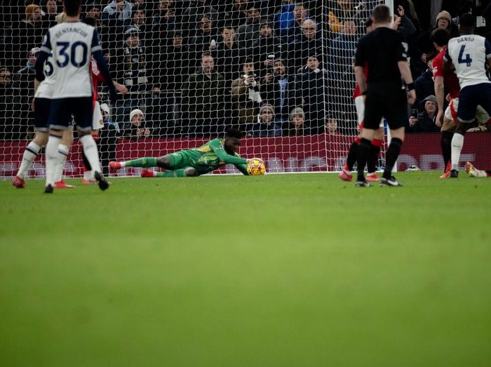 LONDON, ENGLAND - FEBRUARY 16: Andre Onana of Manchester United makes a save during the Premier League match between Tottenham Hotspur FC and Manchester United FC at Tottenham Hotspur Stadium on February 16, 2025 in London, England. (Photo by Ash Donelon/Manchester United via Getty Images)