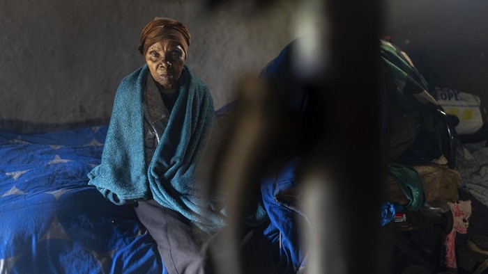 Nozuko Majola's grand mother sits in her Umzimkhulu home Tuesday, Nov. 11, 2025, affected by U.S. President Donald Trump's global foreign aid freeze, raising worries about HIV patients defaulting on treatment. (AP Photo/Jerome Delay)