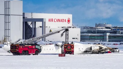 First responders work at the Delta Air Lines plane crash site at Toronto Pearson International Airport in Mississauga, Ontario, Canada February 17, 2025. REUTERS/Arlyn McAdorey Purchase Licensing Rights
