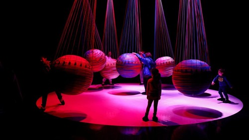 People interact with an art installation made with balloons during a visit to the 'Euphoria' exhibition of the Balloon Museum, set up at La Nuvola conference centre in Rome, Italy, February 8, 2025. REUTERS /Yara Nardi