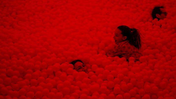 People interact with an art installation made with balloons during a visit to the 'Euphoria' exhibition of the Balloon Museum, set up at La Nuvola conference centre in Rome, Italy, February 8, 2025. REUTERS /Yara Nardi