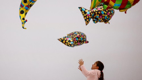 People interact with an art installation made with balloons during a visit to the 'Euphoria' exhibition of the Balloon Museum, set up at La Nuvola conference centre in Rome, Italy, February 8, 2025. REUTERS /Yara Nardi