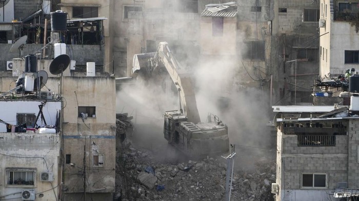 Smoke rises in the Tulkarem refugee camp West Bank, as the Israeli military continues its operation in the area on Tuesday, Feb. 18, 2025. (AP Photo/Majdi Mohammed)