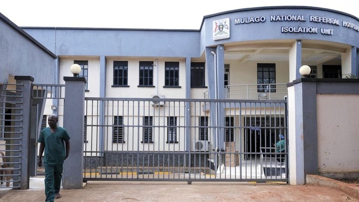 A health worker walks outside Mulago Referral Hospital in Kampala, Uganda Tuesday, Feb. 18, 2025. (AP Photo/Hajarah Nalwadda)