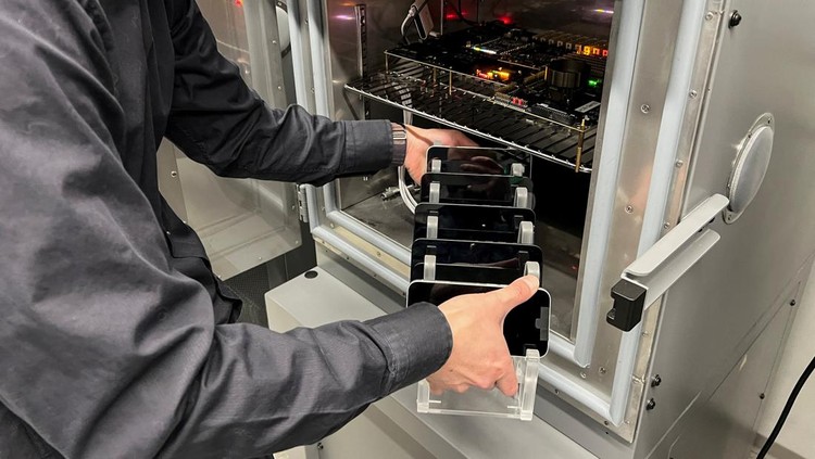 An Apple engineer stress tests an iPhone 16e and the new C1 cellular modem at an Apple lab in Sunnyvale, California, U.S., February 18, 2025. REUTERS/Stephen Nellis