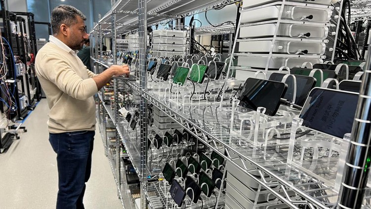 An Apple engineer stress tests an iPhone 16e and the new C1 cellular modem at an Apple lab in Sunnyvale, California, U.S., February 18, 2025. REUTERS/Stephen Nellis