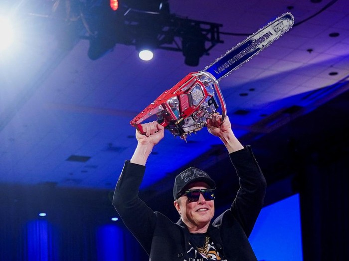 Elon Musk holds a chainsaw onstage as he attends the Conservative Political Action Conference (CPAC) in National Harbor, Maryland, U.S., February 20, 2025. REUTERS/Nathan Howard     TPX IMAGES OF THE DAY
