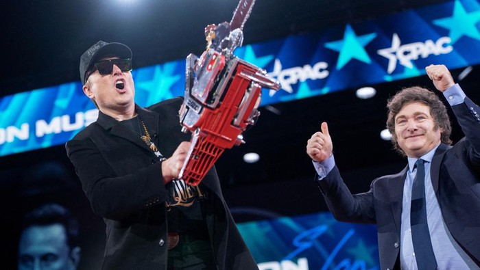 Elon Musk displays a chainsaw given to him by President of Argentina Javier Milei during the Conservative Political Action Conference (CPAC) in National Harbor, Maryland, U.S., February 20, 2025. REUTERS/Nathan Howard     TPX IMAGES OF THE DAY