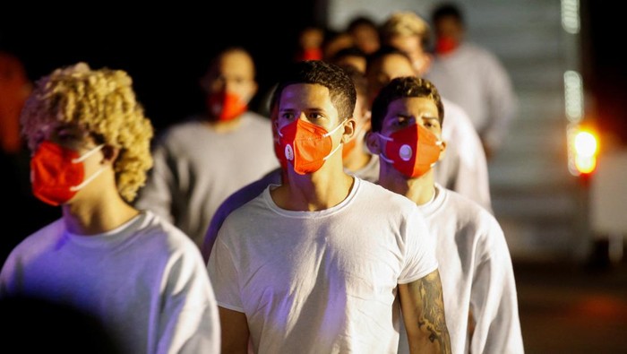 Venezuelan migrants flown from Guantanamo Bay via Honduras, arrive on a deportation flight at Simon Bolivar International Airport in Maiquetia, La Guaira State, Venezuela, February 20, 2025. REUTERS/Leonardo Fernandez Viloria TPX IMAGES OF THE DAY