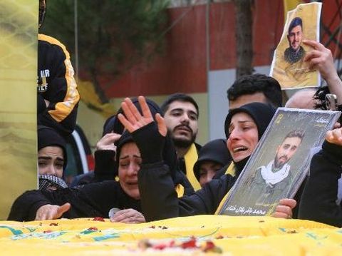 Lebanese mourners attend the funeral of Hezbollah fighters, who were killed in the recent war with Israel, in Ainata in south Lebanon on February 22, 2024. (Photo by Mahmoud ZAYYAT / AFP)