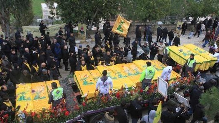 Lebanese mourners attend the funeral of Hezbollah fighters, who were killed in the recent war with Israel, in Ainata in south Lebanon on February 22, 2024. (Photo by Mahmoud ZAYYAT / AFP)