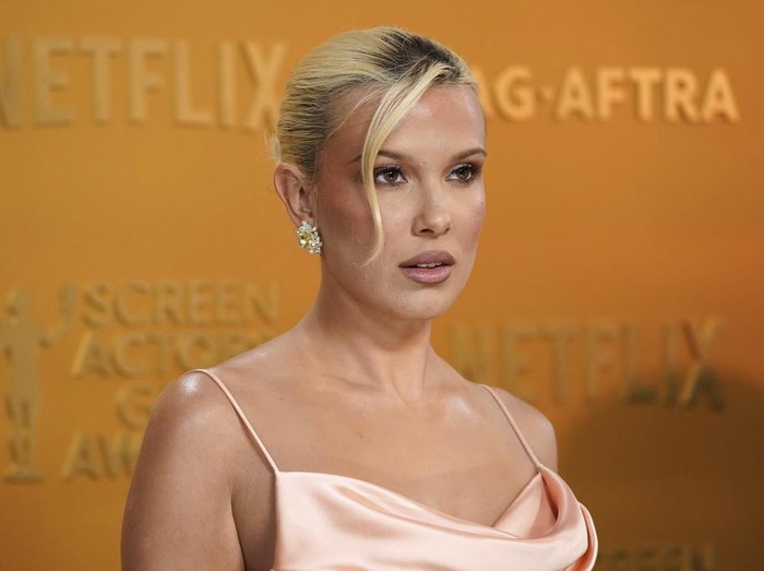 Millie Bobby Brown arrives at the 31st annual Screen Actors Guild Awards on Sunday, Feb. 23, 2025, at the Shrine Auditorium in Los Angeles. (Photo by Jordan Strauss/Invision/AP)