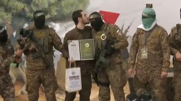 Omer Shem Tov, Eliya Cohen and Omer Wenkert, hostages held in Gaza since the deadly October 7, 2023 attack, are released as part of a ceasefire and a hostages-prisoners swap deal between Hamas and Israel, in Nuseirat, central Gaza Strip, in this still image taken from a video, February 22, 2025. REUTERS/REUTERS TV