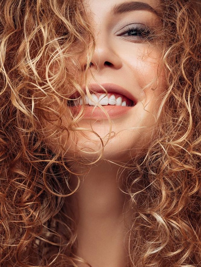 Brown haired woman with voluminous hairstyle