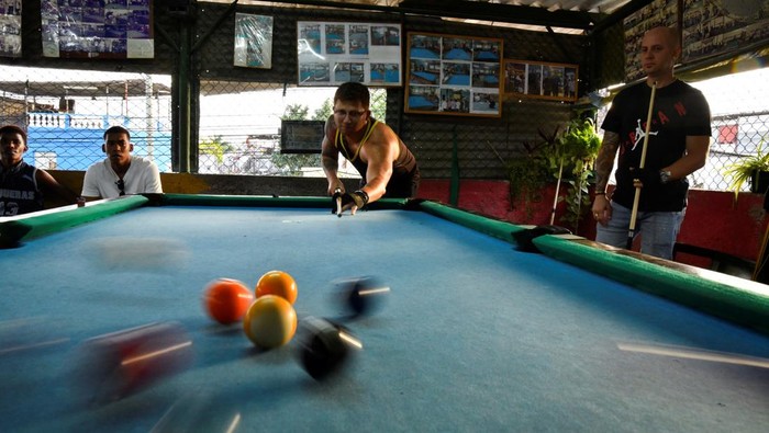 Students play pool at a billiards academy in Havana, Cuba February 17, 2025. REUTERS/Norlys Perez