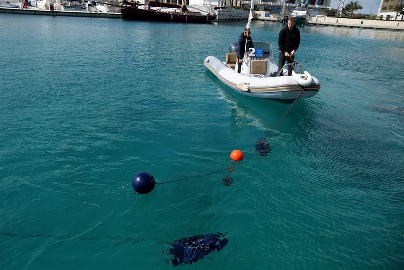 An underwater drone passes inside the seawater during a demonstration at a Marina in the southern resort of Ayia Napa, Cyprus, Monday, Feb. 24, 2025. (AP Photo/Petros Karadjias)