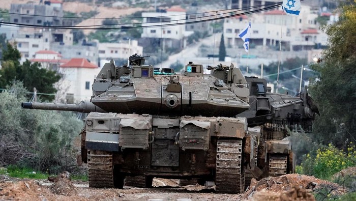 Israeli soldiers take part in an operation in Jenin, in the Israeli-occupied West Bank, February 24, 2025. REUTERS/Raneen Sawafta