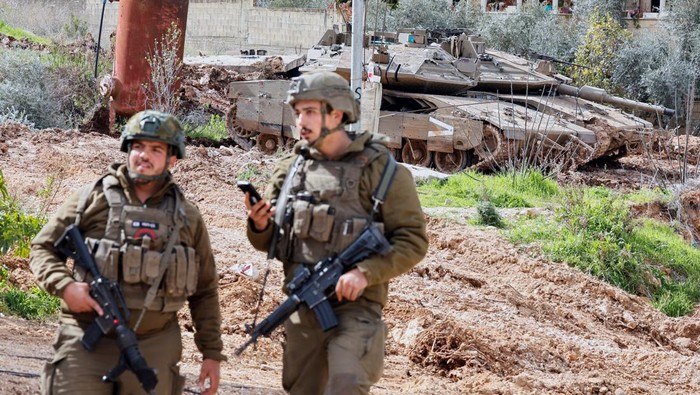 Israeli soldiers take part in an operation in Jenin, in the Israeli-occupied West Bank, February 24, 2025. REUTERS/Raneen Sawafta