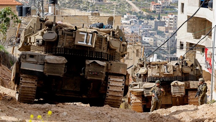 Israeli soldiers take part in an operation in Jenin, in the Israeli-occupied West Bank, February 24, 2025. REUTERS/Raneen Sawafta