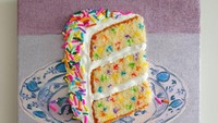 Kalau kreasi bordir satu ini berbentuk irisan kue yang warnanya cantik. Kuenya berupa 3 lapisan bolu dengan tambahan krim vanila dan meisjes pelangi. Foto: Instagram @heather_rios_arte
