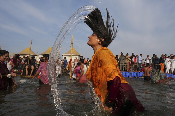 Bollywood actor Raveena Tandon takes ritualist dips at Sangam, the confluence of rivers the Ganges, the Yamuna and the mythical Saraswati during the Maha Kumbh festival, in Prayagraj, India, Tuesday, Feb. 25, 2025. (AP Photo/Rajesh Kumar Singh)