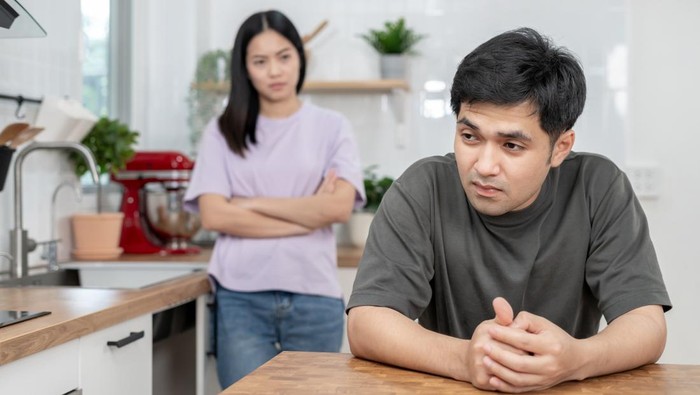 Divorce. Asian couples are desperate and disappointed after marriage. Husband and wife are sad, upset and frustrated after quarrels. distrust, love problems, betrayals. family problem, teenage love