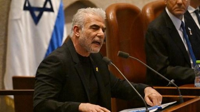 Israels opposition leader Yair Lapid of Yesh Atid, speaks at the opening of the 25th Parliament session in Jerusalem on October 28, 2024. (Photo by DEBBIE HILL / POOL / AFP)