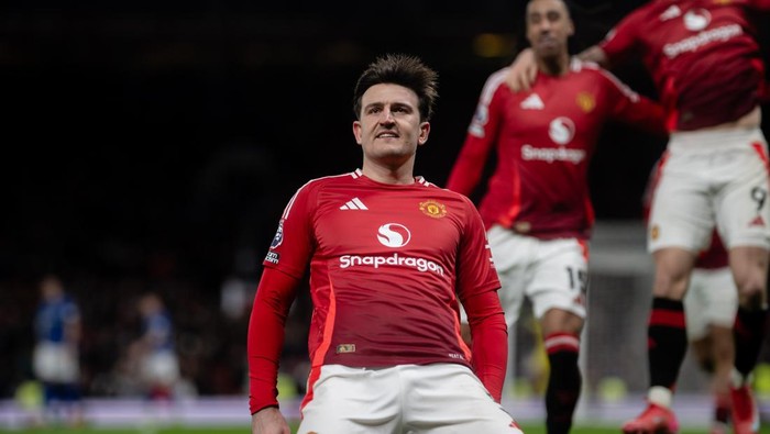 MANCHESTER, ENGLAND - FEBRUARY 26: Harry Maguire of Manchester United celebrates scoring their third goal during the Premier League match between Manchester United FC and Ipswich Town FC at Old Trafford on February 26, 2025 in Manchester, England. (Photo by Ash Donelon/Manchester United via Getty Images)