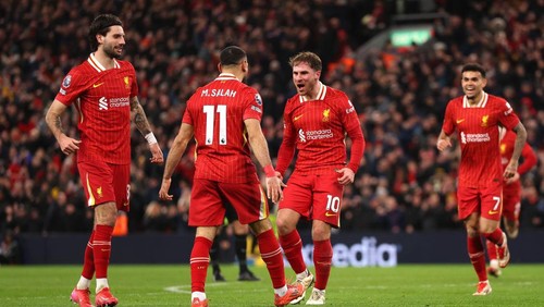 LIVERPOOL, ENGLAND - FEBRUARY 26: Alexis Mac Allister of Liverpool celebrates scoring his teams second goal with teammate Mohamed Salah  during the Premier League match between Liverpool FC and Newcastle United FC at Anfield on February 26, 2025 in Liverpool, England. (Photo by Carl Recine/Getty Images)