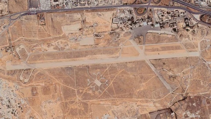 A satellite image shows Mezzeh military airport, at a time when it was being used as a detention center by the Assad regime and killings were widespread, according to witness accounts collected by the Syria Justice and Accountability Centre, in Damascus, Syria. Satellite image from June 3, 2014. MAXAR TECHNOLOGIES VIA GOOGLE/Handout via REUTERS/File Photo Purchase Licensing Rights