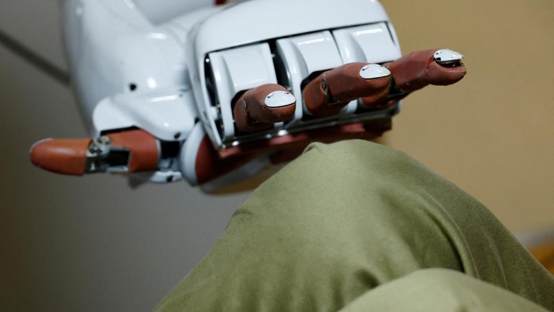 Waseda University professor Shigeki Sugano talks about AIREC, an artificial intelligence (AI)-driven humanoid robot, at the university's laboratory in Tokyo, Japan February 17, 2025. REUTERS/Kim Kyung-Hoon