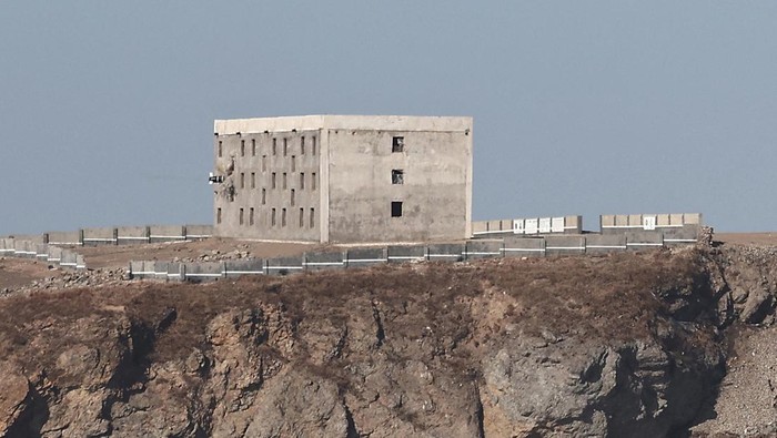 A building is striked during what state media KCNA says is a test-launch of a strategic cruise missile designed to demonstrate the readiness posture of various nuclear capabilities, over the sea off the west coast of the Korean peninsula, February 26, 2025, in this photo released by North Korea's official Korean Central News Agency on February 27, 2025. KCNA via REUTERS ATTENTION EDITORS - THIS IMAGE WAS PROVIDED BY A THIRD PARTY. REUTERS IS UNABLE TO INDEPENDENTLY VERIFY THIS IMAGE. NO THIRD PARTY SALES. SOUTH KOREA OUT. NO COMMERCIAL OR EDITORIAL SALES IN SOUTH KOREA.